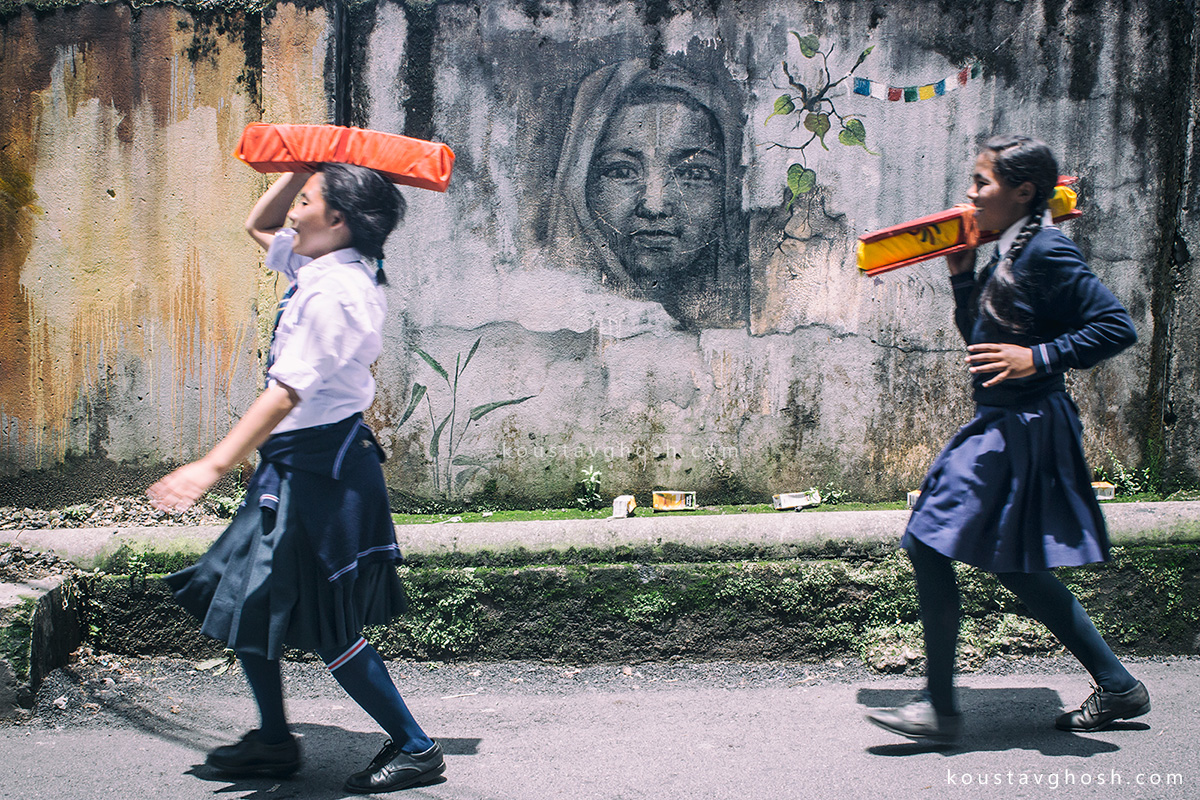 School children carrying Holy Books during Saga Dawa